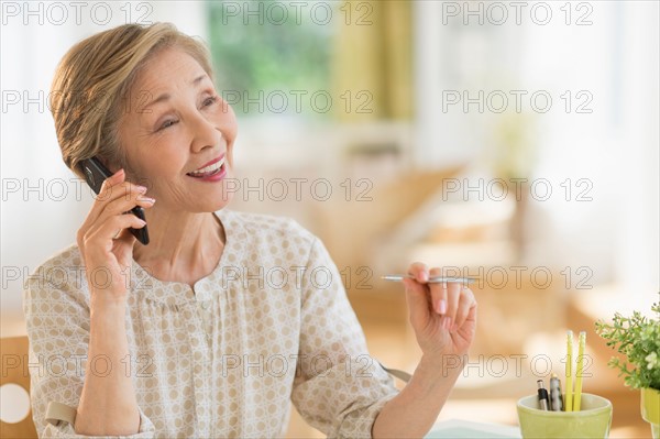 Senior woman talking on phone.