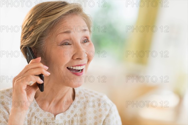 Senior woman talking on phone.