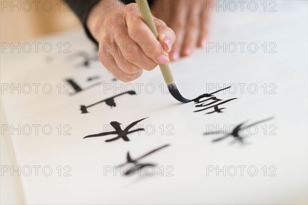 Female hand and japanese calligraphy.