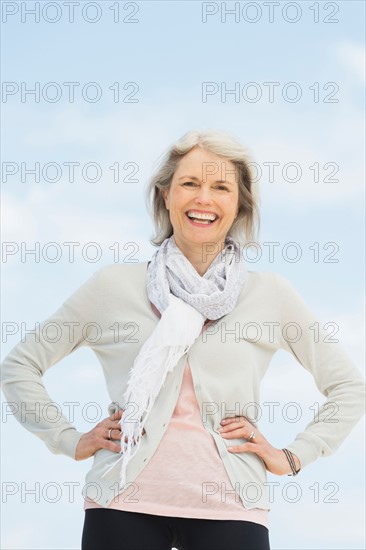 Portrait of senior woman standing outdoors.