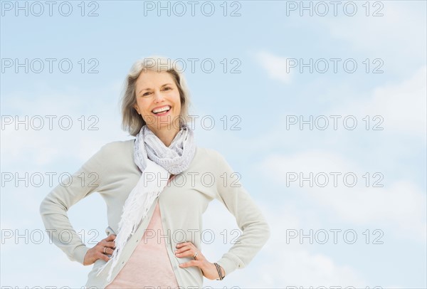 Portrait of senior woman standing outdoors.