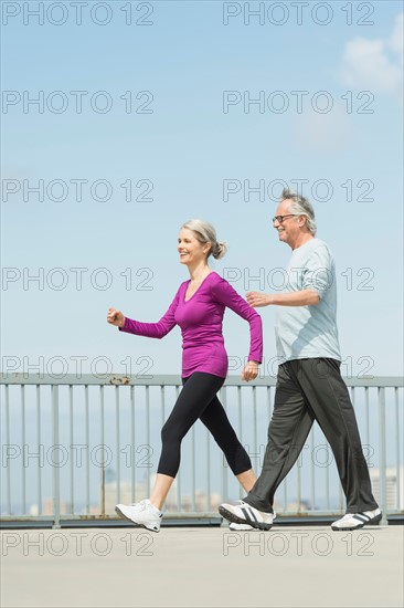 Senior couple walking together.