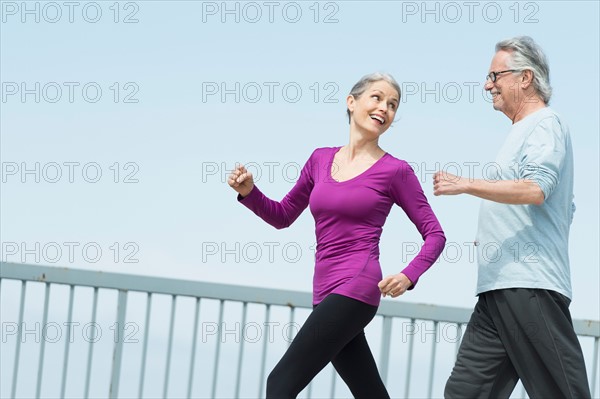Senior couple walking together.