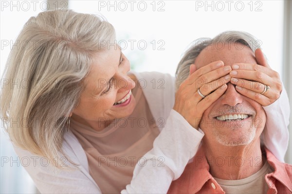 Playful senior couple.