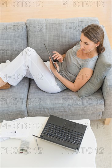 Young woman doing home finances.