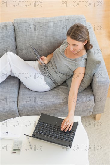 Young woman doing home finances.