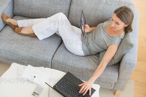 Young woman doing home finances.