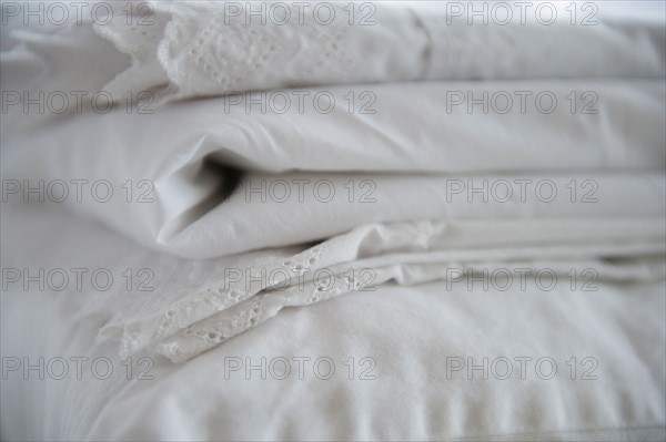 Close up of folded white sheets, studio shot