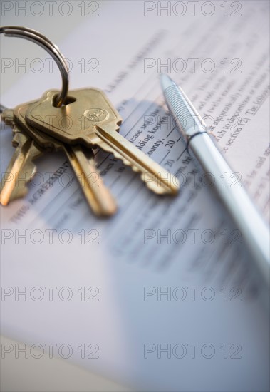 Close up of keys and document, studio shot