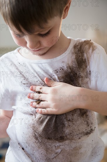 Portrait of boy (4-5) in dirty t-shirt