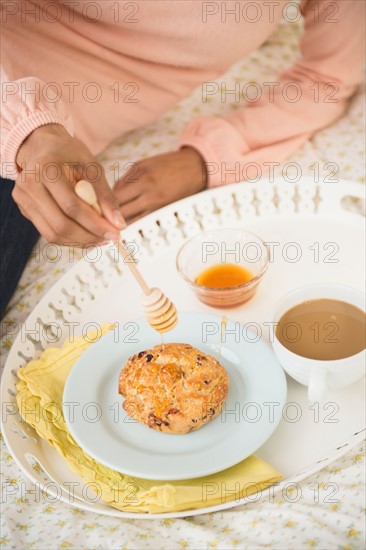 Woman having breakfast in bed