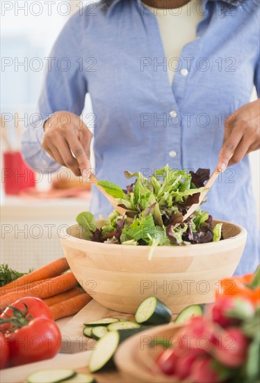 Woman preparing salad