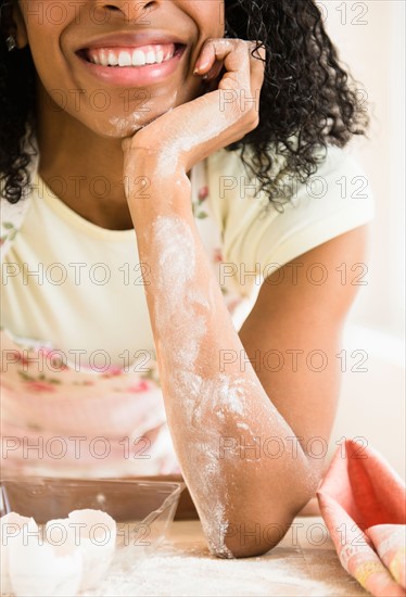Mid section of woman covered with flour