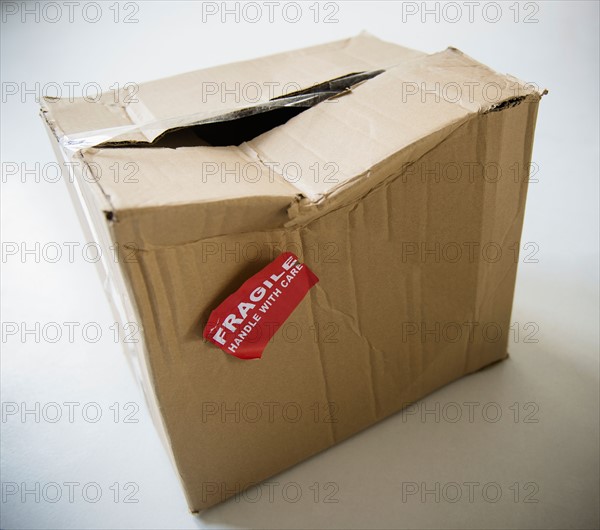 Studio Shot of damaged box with fragile label