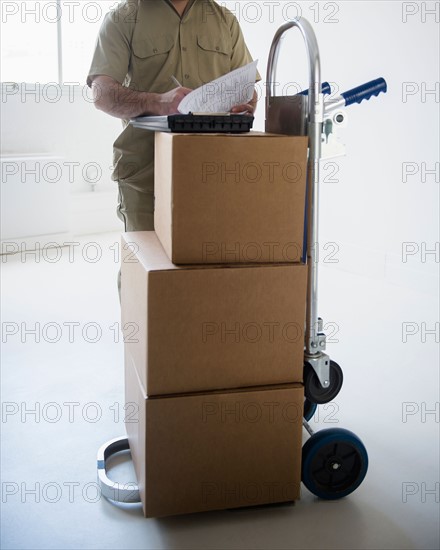 Delivery man filling documents