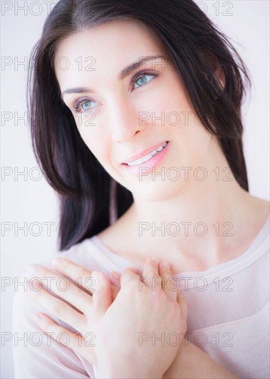 Portrait of smiling woman with arms crossed