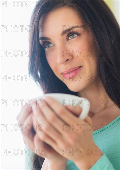 Woman with cup in hand