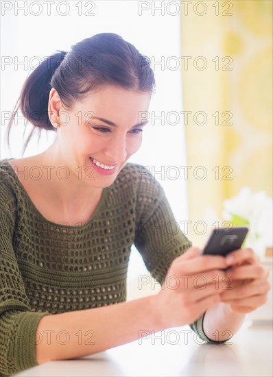 Portrait of woman using mobile phone