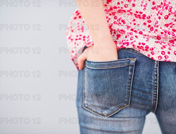 Rear view of woman with hands in pocket