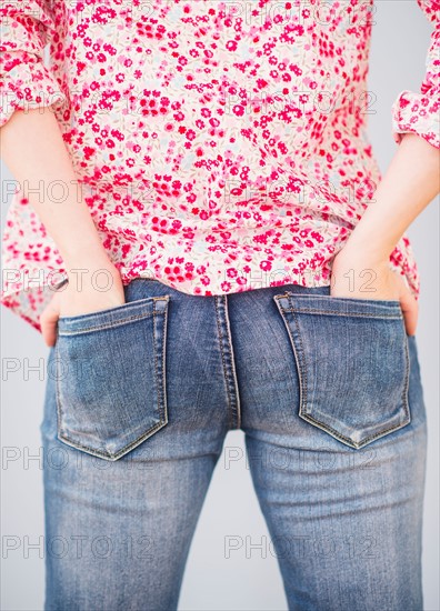 Rear view of woman with hands in pocket