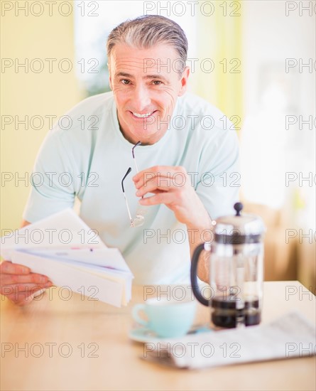 Portrait of man at kitchen table