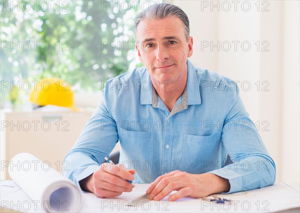 Portrait of man working in office