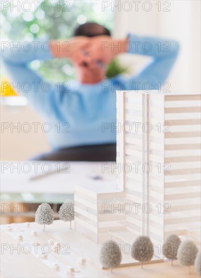 Rear view of man sitting in office