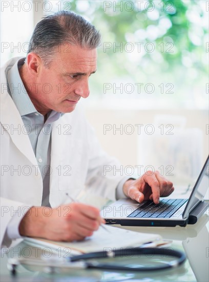 Portrait of doctor working in his office