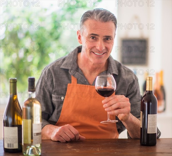 Portrait of man tasting wine