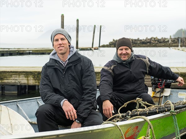 Portrait of men in boat