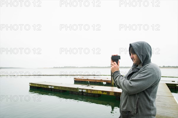 Side view of man photographing