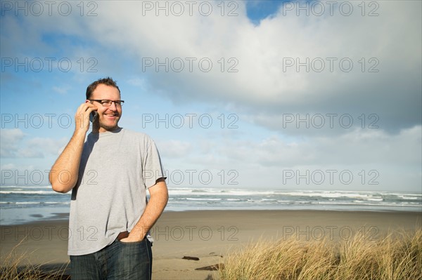 Mid adult man taking photograph