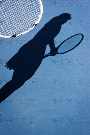 Shadow of female tennis player