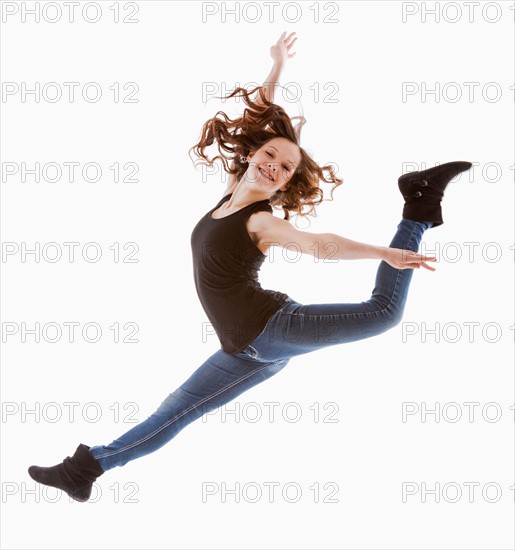 Portrait of jumping girl (12-13)