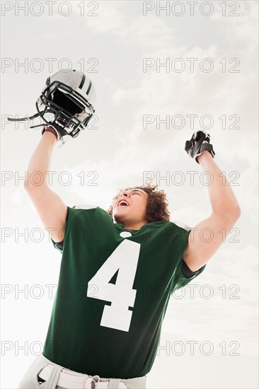 Portrait of American football player celebrating victory