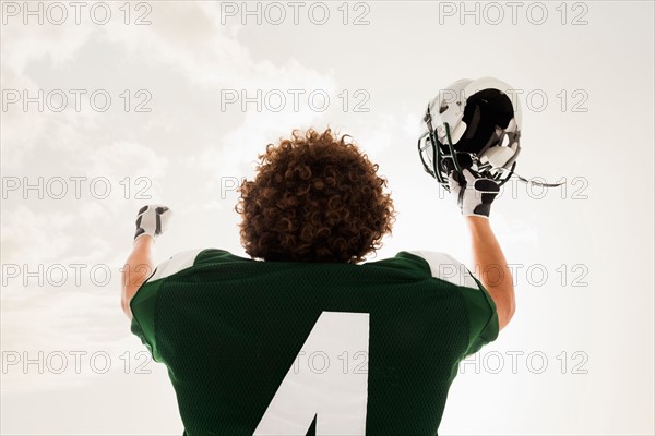 Portrait of American football player celebrating victory