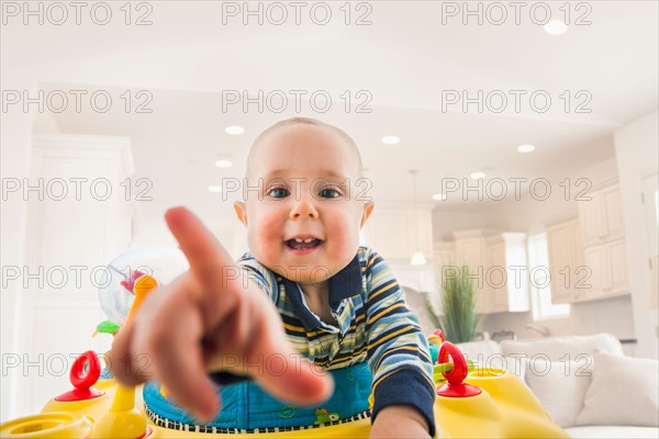 Portrait of baby (18-23 months) pointing