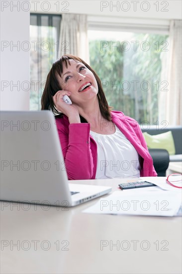 Mature businesswoman talking on phone