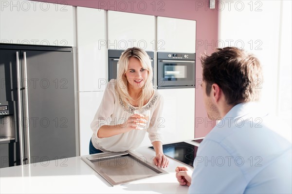 Young couple in kitchen