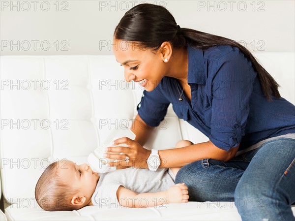 Mother feeding baby (2-5 moths)