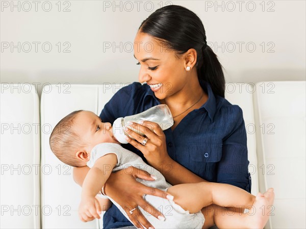 Mother feeding baby (2-5 moths)