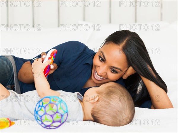 Mother playing with her son (2-5 months)