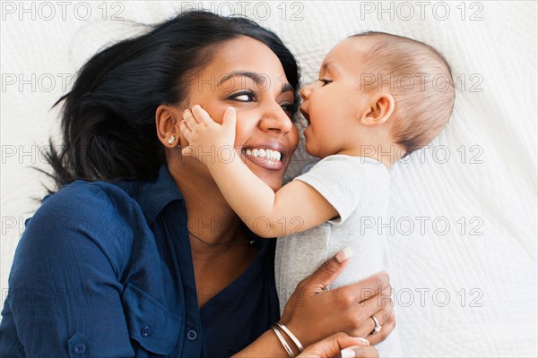 Mother hugging her son (2-5 months)