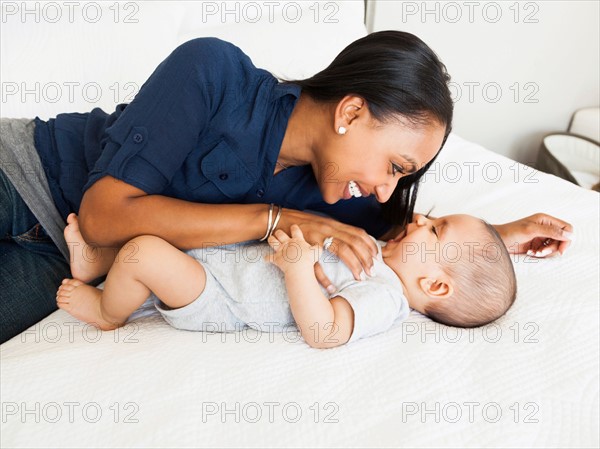 Mother playing with her son (2-5 months)