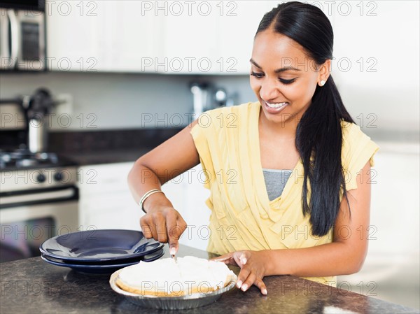 Woman preparing meal in kitchen