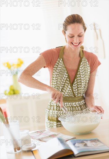Woman cooking in kitchen.