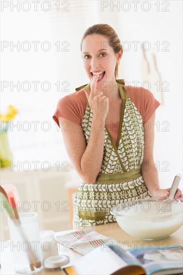 Woman cooking in kitchen.