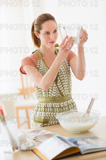 Woman cooking in kitchen.