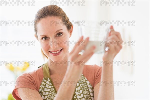 Portrait of woman cooking.