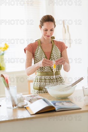 Woman cooking in kitchen.